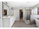 Light-filled bathroom features walk-in shower, soaking tub, and double vanity at 16110 Foreleigh Rd, Huntersville, NC 28078