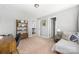 Bright bedroom featuring a chaise lounge and neutral walls at 16110 Foreleigh Rd, Huntersville, NC 28078