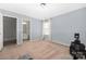 Neutral bedroom with light-blue walls, carpet floors, and ensuite bathroom at 16110 Foreleigh Rd, Huntersville, NC 28078