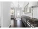 Welcoming hallway featuring a console table, a mirror and a view of the front door at 16110 Foreleigh Rd, Huntersville, NC 28078