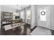 Bright home office with hardwood floors, a large window, and modern desk setup at 16110 Foreleigh Rd, Huntersville, NC 28078