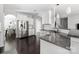 Bright kitchen featuring white cabinets, granite countertops, and stainless steel appliances at 16110 Foreleigh Rd, Huntersville, NC 28078