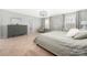 Bright main bedroom with a soft color palette, carpet flooring and modern chandelier at 16110 Foreleigh Rd, Huntersville, NC 28078