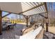 Covered patio features a built-in outdoor kitchen, dining area and seating area at 16110 Foreleigh Rd, Huntersville, NC 28078