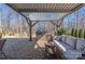 Paver patio features a custom brick outdoor kitchen and relaxing outdoor seating areas at 16110 Foreleigh Rd, Huntersville, NC 28078