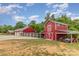 Red barns and outbuildings offer ample storage and workspace at 223 Scottish Dr, Mooresville, NC 28115