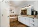Bathroom featuring a soaking tub, granite countertop, and a decorative wood accent wall at 223 Scottish Dr, Mooresville, NC 28115