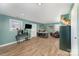Large bonus room with wood-look flooring, ample natural light, and a rustic deer head mount at 223 Scottish Dr, Mooresville, NC 28115