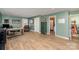 Bonus room with desk, leather chair, and a view into an attached bathroom at 223 Scottish Dr, Mooresville, NC 28115