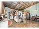 Modern kitchen with a central island, stainless steel appliances, and seamless flow to the living space at 223 Scottish Dr, Mooresville, NC 28115