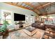 Bright living room showcasing a large TV, comfortable seating, and a stylish rug at 223 Scottish Dr, Mooresville, NC 28115