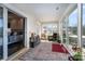 Bright and airy sun room with sliding glass doors, and views of the surrounding landscape at 223 Scottish Dr, Mooresville, NC 28115