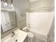 Bathroom featuring a single sink vanity, a shower-tub combo, and neutral paint at 2702 Occaneechi Ct, Waxhaw, NC 28173