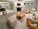Bright living room with fireplace, plush seating, and open layout to the kitchen at 2702 Occaneechi Ct, Waxhaw, NC 28173