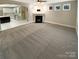 Spacious living room with a fireplace and open layout, ready for your personal touch at 2702 Occaneechi Ct, Waxhaw, NC 28173