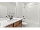 Bathroom featuring a modern vanity, toilet, and tiled shower with a black shower head at 3017 Tramore Dr, Harrisburg, NC 28075