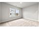 Light-filled bedroom featuring soft carpet, neutral paint, and a window with neighborhood views at 3017 Tramore Dr, Harrisburg, NC 28075