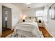 Bedroom with hardwood floors, natural light, and modern lamps at 315 Wakefield Dr, Charlotte, NC 28209