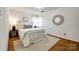 Inviting bedroom with wood floors, natural light, and a decorative mirror at 315 Wakefield Dr, Charlotte, NC 28209