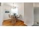 Cozy dining area featuring a modern chandelier, round table, and woven chairs at 315 Wakefield Dr, Charlotte, NC 28209
