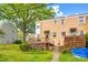 Charming home with back deck, green yard, and mature tree providing ample shade and curb appeal at 315 Wakefield Dr, Charlotte, NC 28209