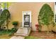 Close up of the front door of a charming townhome surrounded by lush greenery at 315 Wakefield Dr, Charlotte, NC 28209