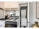 Cozy kitchen with classic gas range, upper cabinets, and convenient in-unit laundry at 315 Wakefield Dr, Charlotte, NC 28209