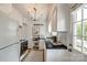 Functional kitchen with white cabinets, black countertops, and access to the outdoors at 315 Wakefield Dr, Charlotte, NC 28209