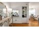 Charming living room view into the kitchen with hardwood floors and classic white walls at 315 Wakefield Dr, Charlotte, NC 28209