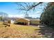 Backyard featuring a storage shed, patio, landscaping, and a fenced perimeter at 3415 23Rd Ne St, Hickory, NC 28601