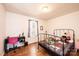 Cozy bedroom featuring a metal frame bed, hardwood floors and a bright window at 3415 23Rd Ne St, Hickory, NC 28601