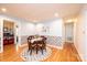 Dining room with wood floors, table with flowers, and decorative wallpaper border at 3415 23Rd Ne St, Hickory, NC 28601