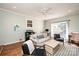 Cozy living room with light walls, ceiling fan and sliding glass doors to the backyard at 3415 23Rd Street Ne St, Hickory, NC 28601