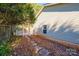 A charming side yard featuring a stone path, a white picket fence, and an archway at 3415 23Rd Ne St, Hickory, NC 28601