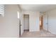 Bedroom with closet, neutral carpet, and connecting doorway at 4005 Lawnview Dr, Charlotte, NC 28269