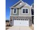 Charming home with a two-car garage and stone accents on the lower level at 4005 Lawnview Dr, Charlotte, NC 28269