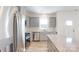 Bright kitchen features stainless steel appliances, light grey cabinets, granite countertops, and natural light at 4005 Lawnview Dr, Charlotte, NC 28269
