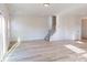 Spacious living room features light wood flooring and a staircase at 4005 Lawnview Dr, Charlotte, NC 28269