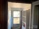 Bright entryway leads to the backyard with shelving on the side, ready for your personal touch at 441 Hope St, Rock Hill, SC 29730