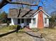 Inviting home exterior featuring a brick chimney and a charming front porch area at 441 Hope St, Rock Hill, SC 29730