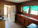 Spacious kitchen with wooden cabinets, a double sink, and natural light from bright windows at 441 Hope St, Rock Hill, SC 29730