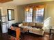 Bright living room featuring a comfortable sofa and natural light from large windows at 441 Hope St, Rock Hill, SC 29730