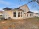 Exterior back of the house with lots of windows and green space in the yard at 5002 Fine Robe Dr, Indian Trail, NC 28079
