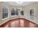 Cozy breakfast nook with large windows providing natural light and a view of the backyard, next to a door at 5002 Fine Robe Dr, Indian Trail, NC 28079
