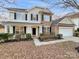 Charming two-story home with brick and siding exterior, two car garage, and manicured lawn at 5002 Fine Robe Dr, Indian Trail, NC 28079