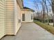 Spacious patio area featuring a modern door and concrete flooring, perfect for outdoor entertaining and relaxation at 5002 Fine Robe Dr, Indian Trail, NC 28079