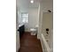 Updated bathroom featuring modern fixtures, dark wood floor and a shower-tub combo at 502 E Maine Ave, Bessemer City, NC 28016