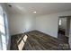 Bedroom featuring laminate flooring, white walls and trim, and natural light at 502 E Maine Ave, Bessemer City, NC 28016