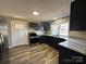 Modern kitchen with stainless steel appliances, sleek cabinetry, and granite countertops at 502 E Maine Ave, Bessemer City, NC 28016