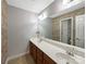 Well-lit bathroom boasts double sinks and a large mirror at 621 Ravenglass Dr, Fort Mill, SC 29715